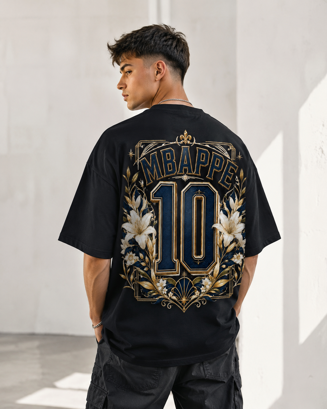 Model wearing the MIRAZUR Blue Dynasty 10 France-inspired oversized football T-shirt with blue and gold number 10 back print
